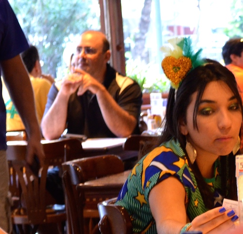 July 4, 2014 Brazilian fan orders from the menu in Ipanema before the Brazil v Colombia match